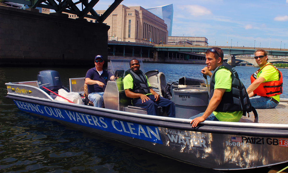 Left to Right: Lance Butler, Dimitri Forte, Declan Patterson, and Richard Anthes. Philadelphia Water’s Watersheds Field Services Group deploys a fleet of three small boats to reach trash in waterways that others can’t. Credit: Brian Rademaekers. 