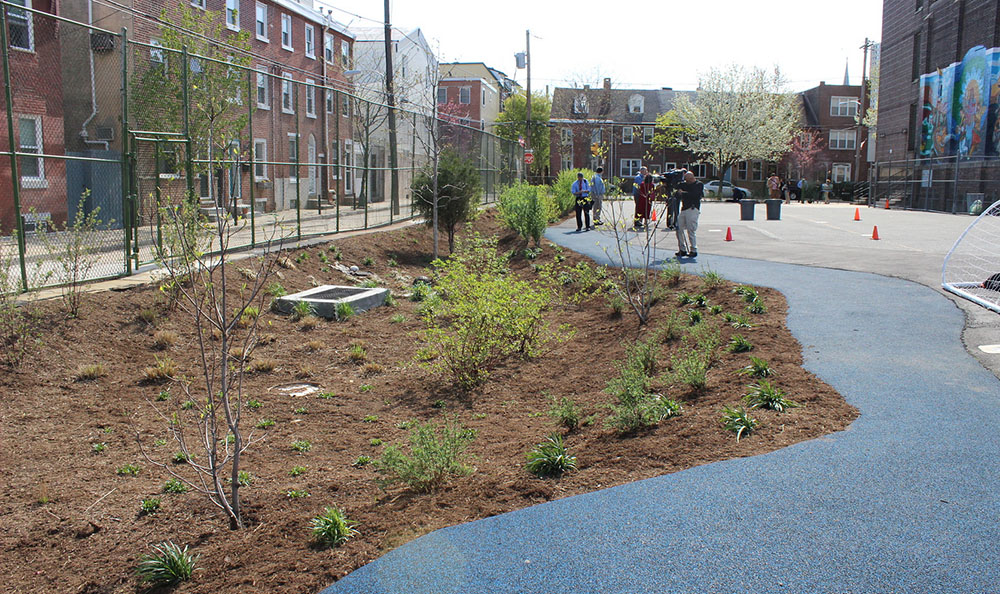 A rain garden and porous pavement enhanced this schoolyard in South Philadelphia. Credit: Philadelphia Water